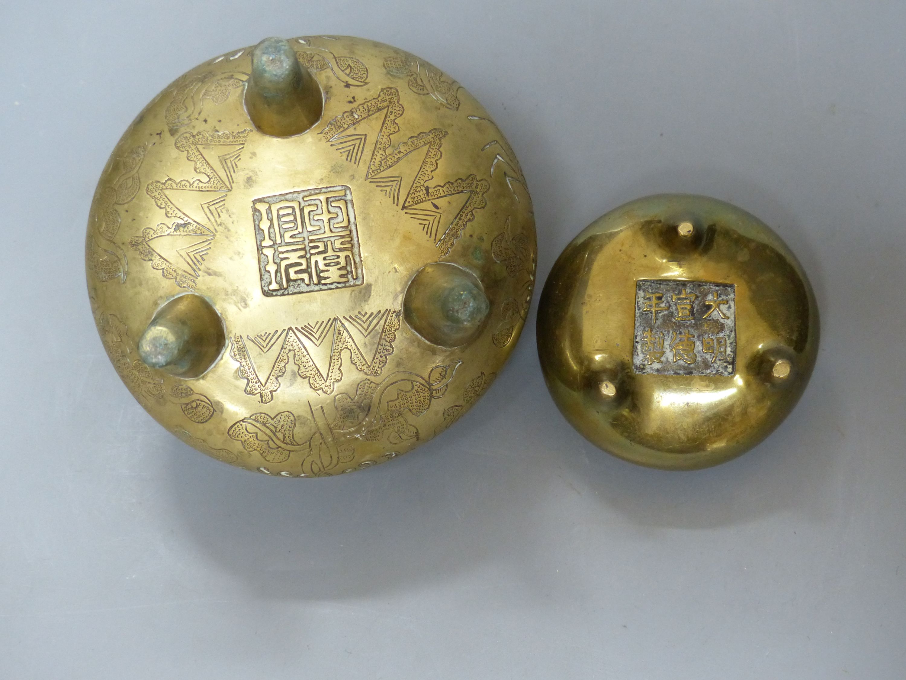 Two Chinese bronze tripod censers, Xuande marks, 19th/20th century, tallest overall 10cm